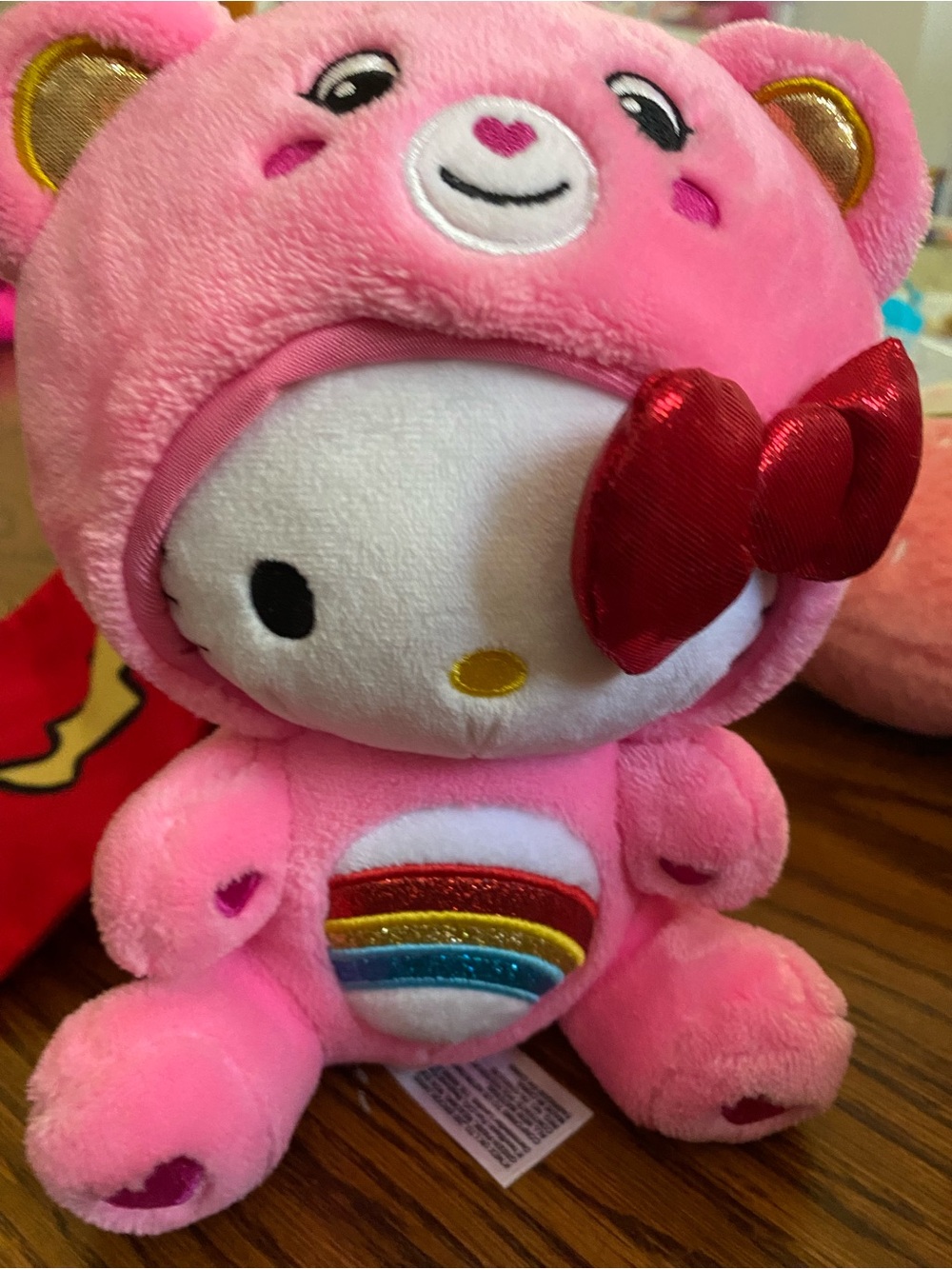 Hello Kitty Pink Plush with Red Metallic Bow and Rainbow Detail